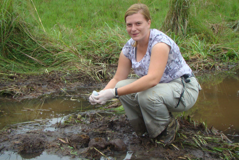 Scientist collecting dung