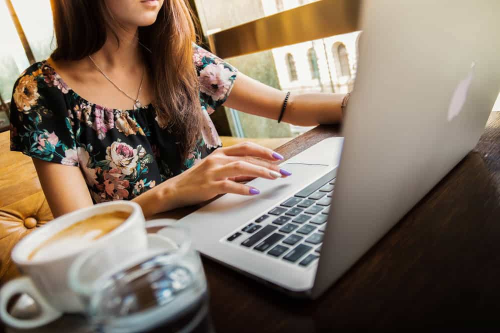 A woman using a Macbook