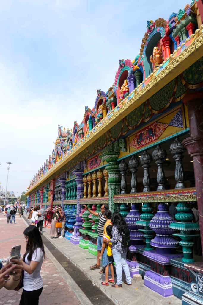 A picture of tourists taking photos of the temple